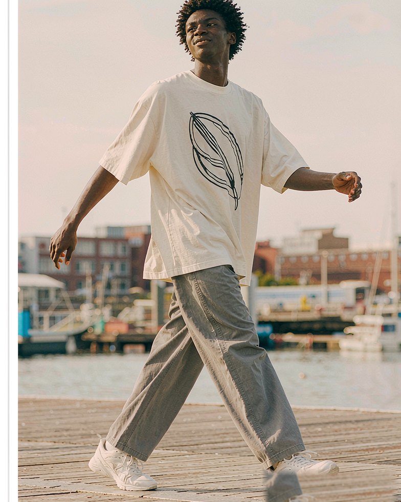 Graphic Tee in Off White worn by a model